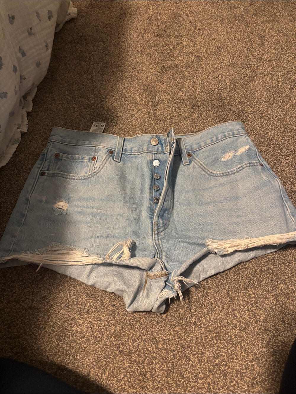 Levi’s 501 High-Rise Light Blue Distressed Denim Shorts
